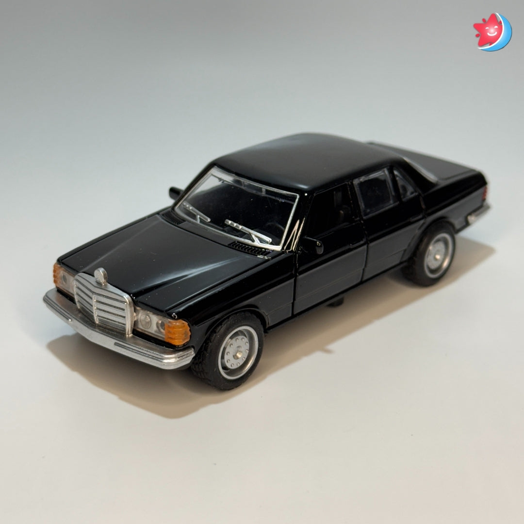 Black model car on a light gray background